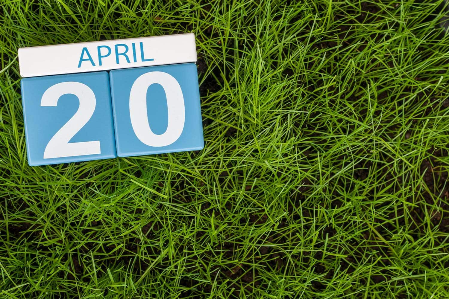 Flip Calendar marked as April 20th on Grass