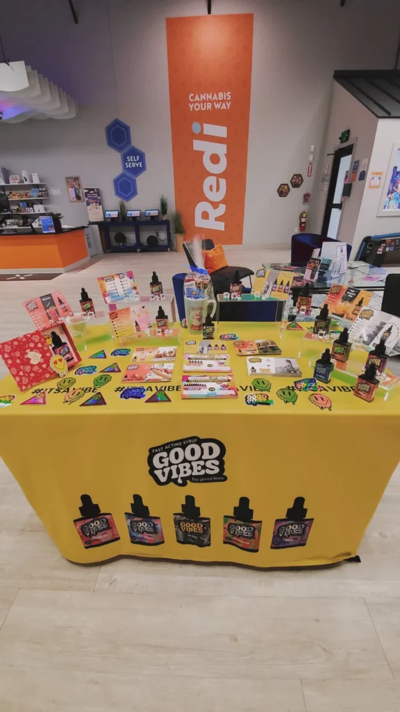 A Good Vibes sign anchoring the retail display at Redi - Natick.