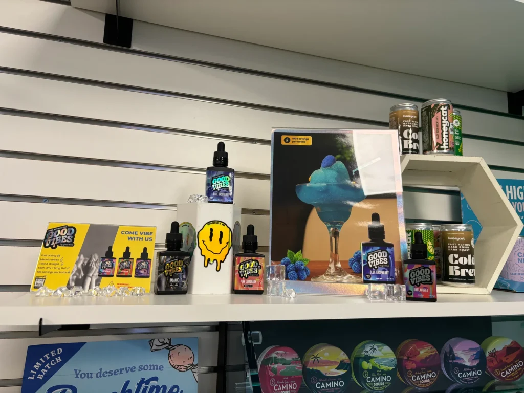 Bright bottle and retail display featuring Balance and Come Vibe at Collective Premium Cannabis – Littleton.