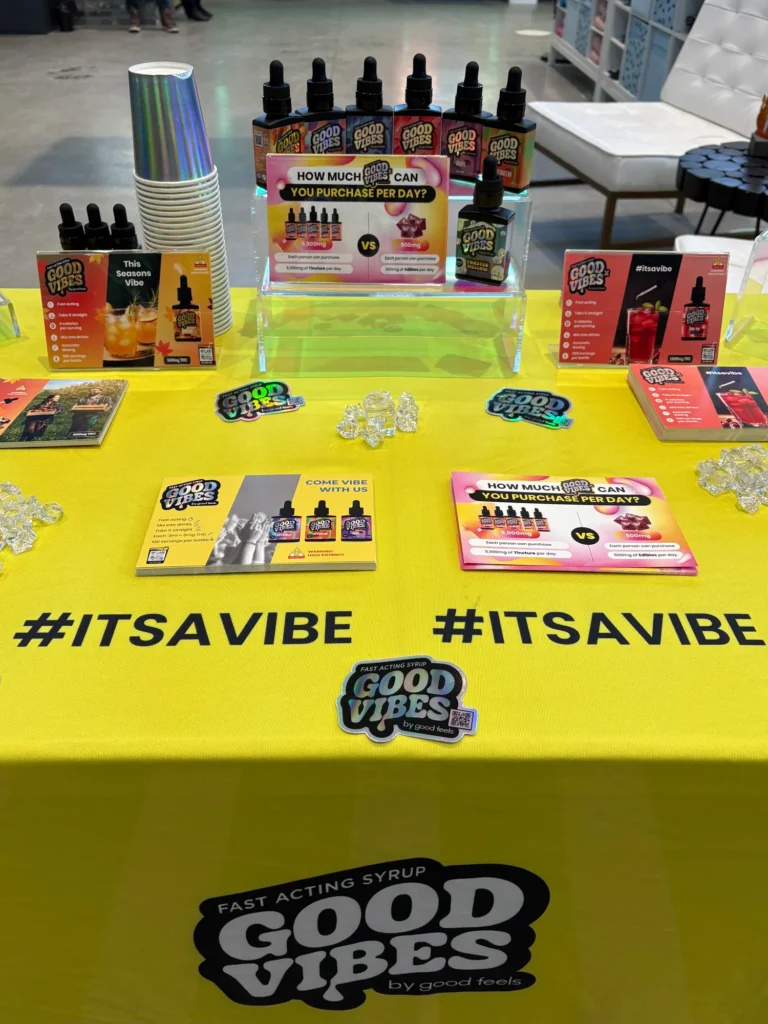 Good Vibes bottles and colorful display cards at Collective Premium Cannabis - Billerica.