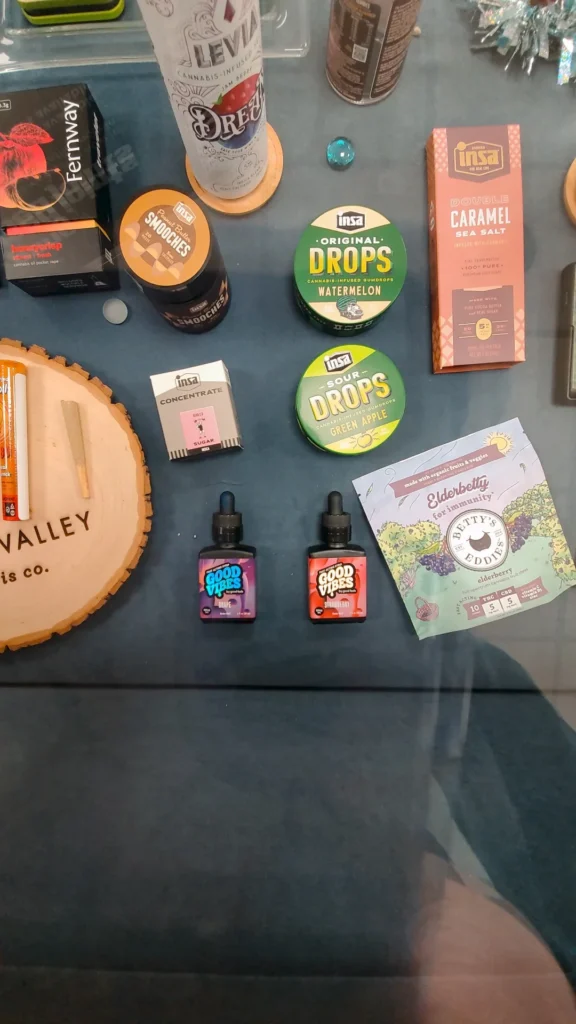 Bottles and colorful display cards at 1 Connection - North Dighton.