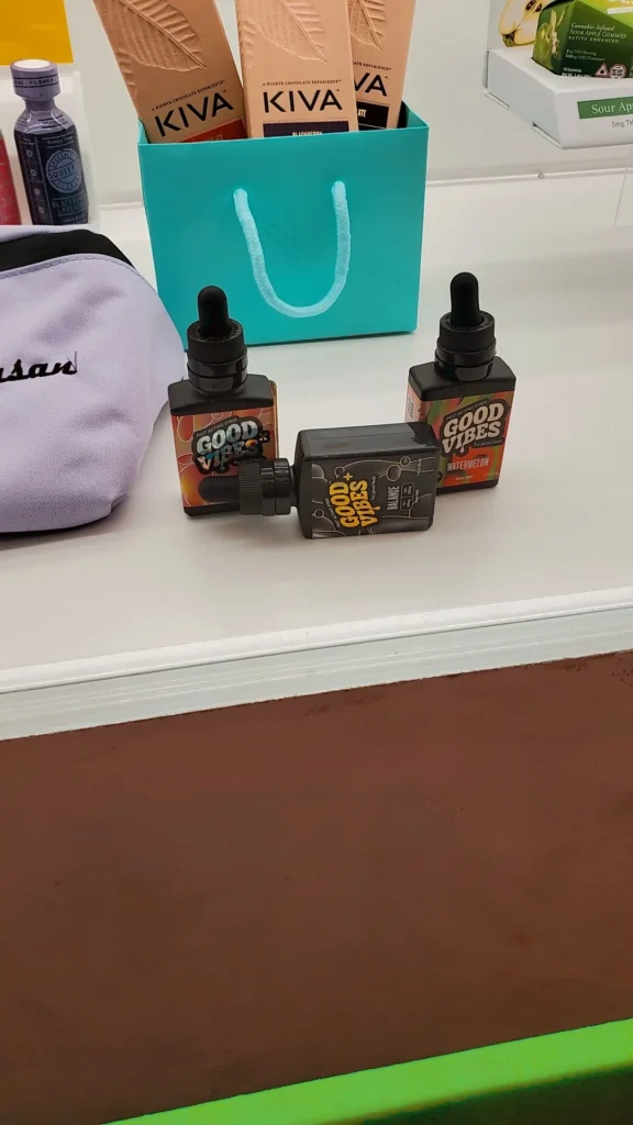 Good Vibes bottles and colorful display cards at BOUTIQ - East Boston.