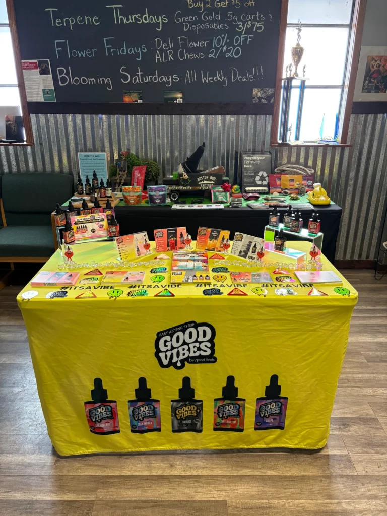 A Good Vibes sign anchoring the retail display at Boston Bud Factory - Holyoke.