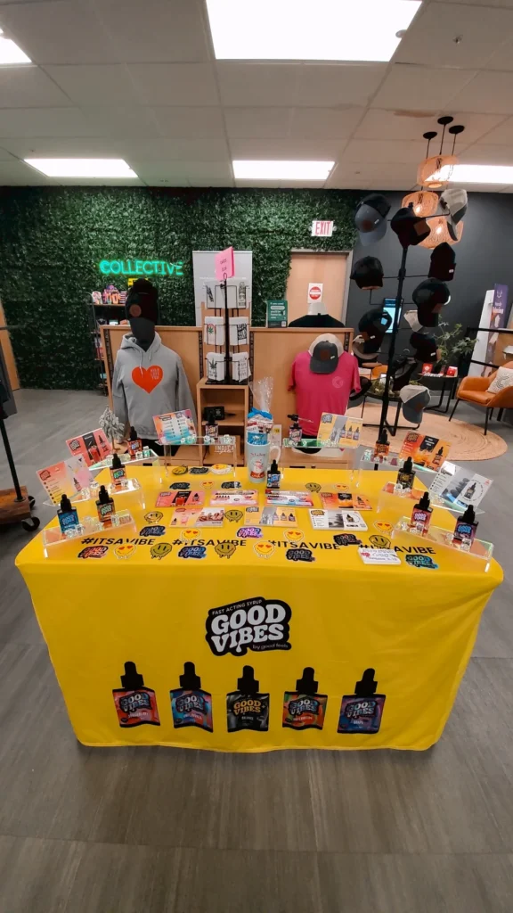 A Good Vibes sign anchoring the retail display at Collective Premium Cannabis - Littleton.