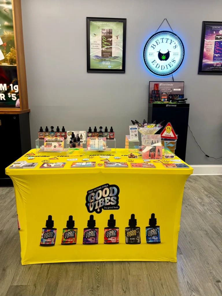 Good Vibes display with Blue Raspberry and Watermelon bottles at The Vault – Webster.
