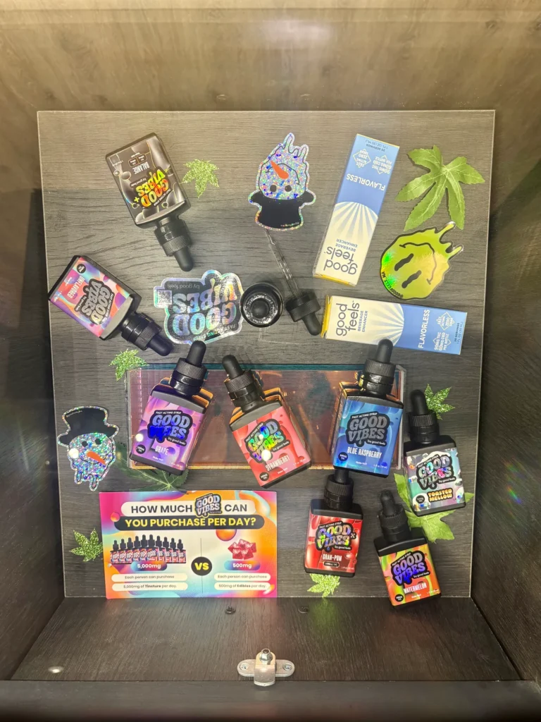 Good Vibes display materials set against warm wood surfaces at New England Harvest - Clinton.