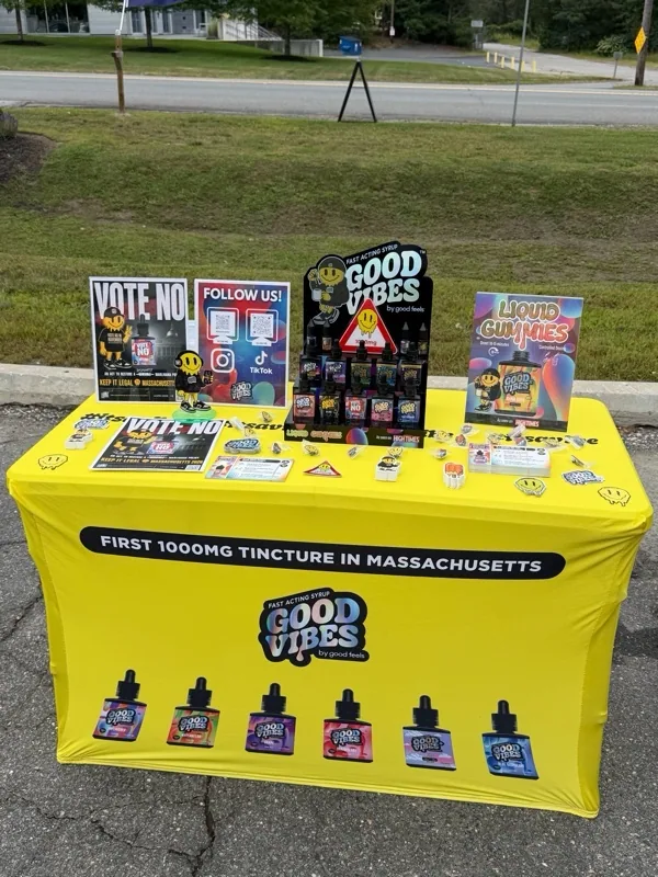Outdoor yellow Good Vibes event table at Joint Operations – Rowley.