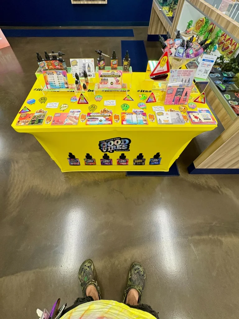 Good Vibes display with Good Vibes packaging and product information at Trinity Naturals – Chelsea.