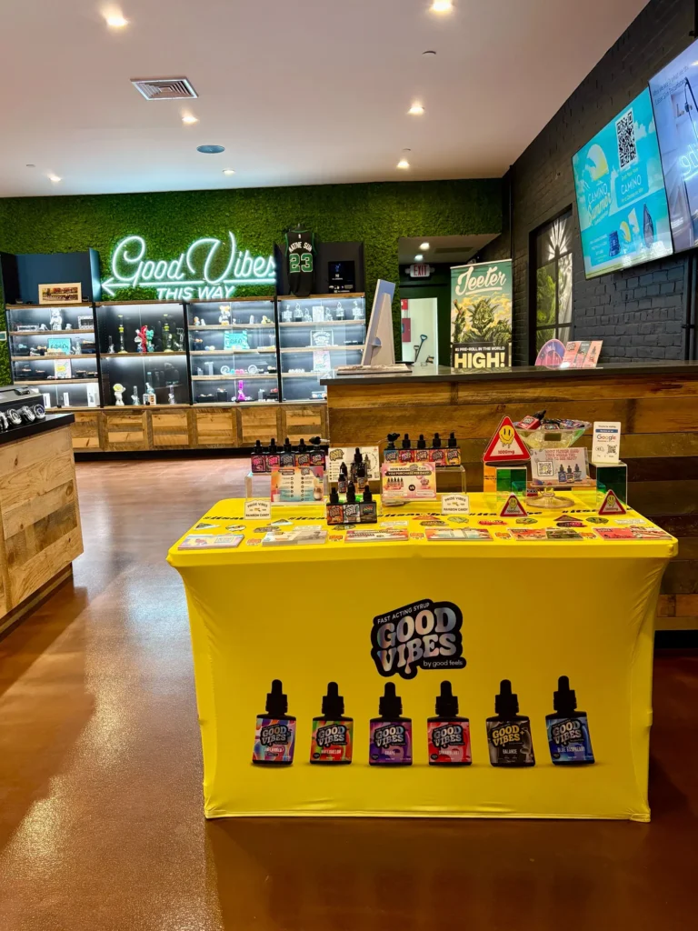 Good Vibes display with Blue Raspberry and Watermelon bottles at Native Sun Wellness – South Boston.