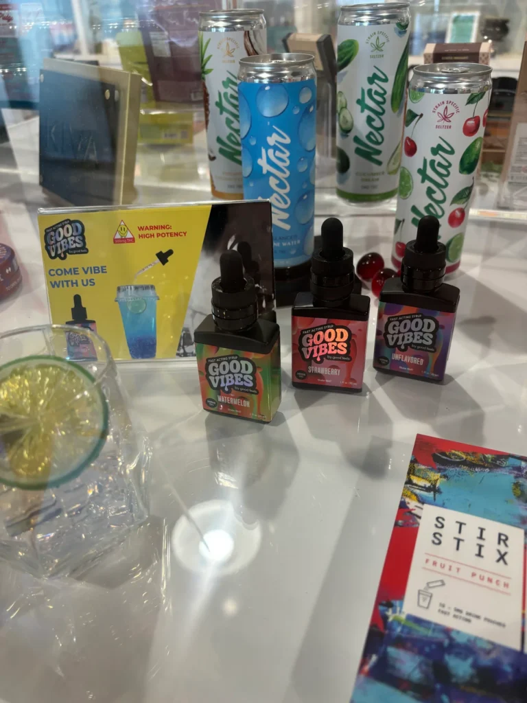 Colorful bottle and retail display featuring fast-acting syrup and Watermelon at South Shore Buds – Marshfield.