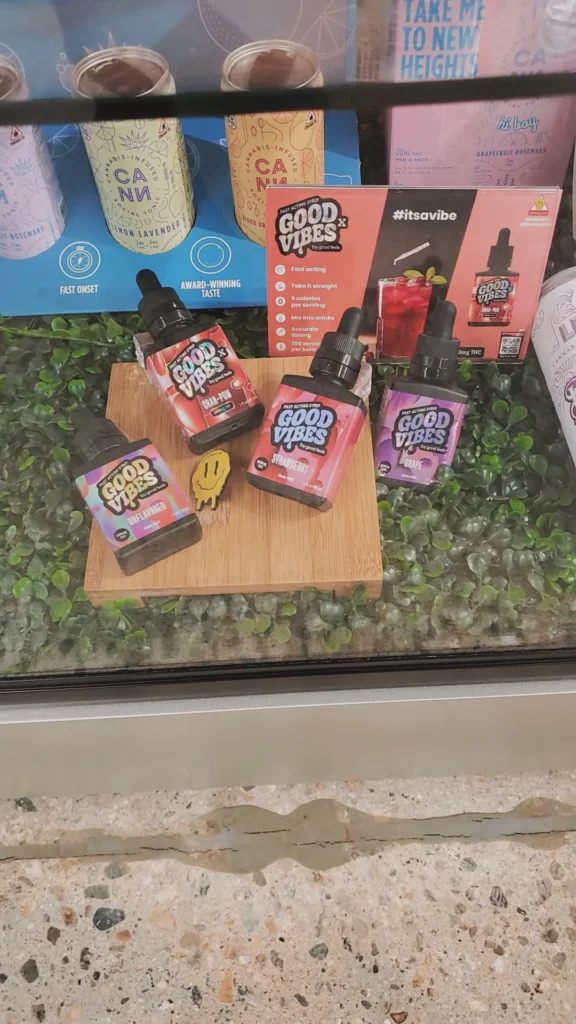 Good Vibes bottles and colorful display cards at Redi - Newton.