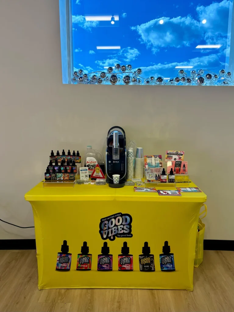 Good Vibes display with Blue Raspberry and Watermelon bottles at Quincy Cannabis.