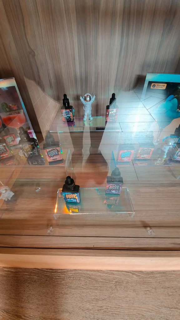 A warm-toned retail display with wood surfaces at Renew Cannabis Co (Berkley).