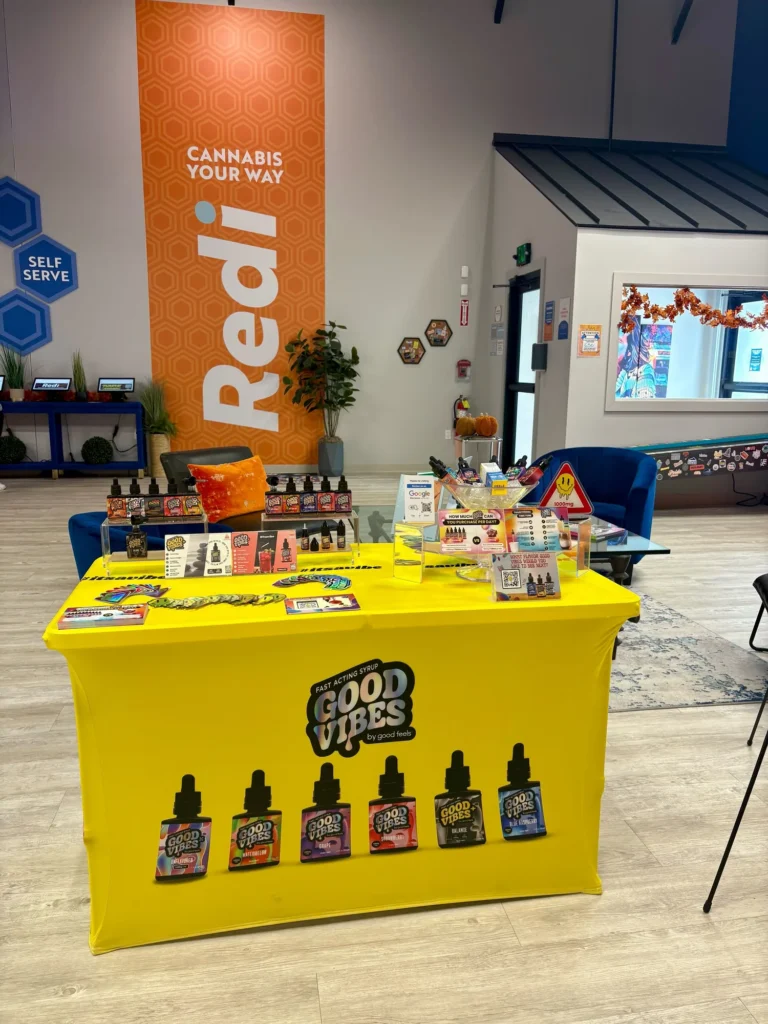 Good Vibes display with Blue Raspberry and Watermelon bottles at Redi – Natick.