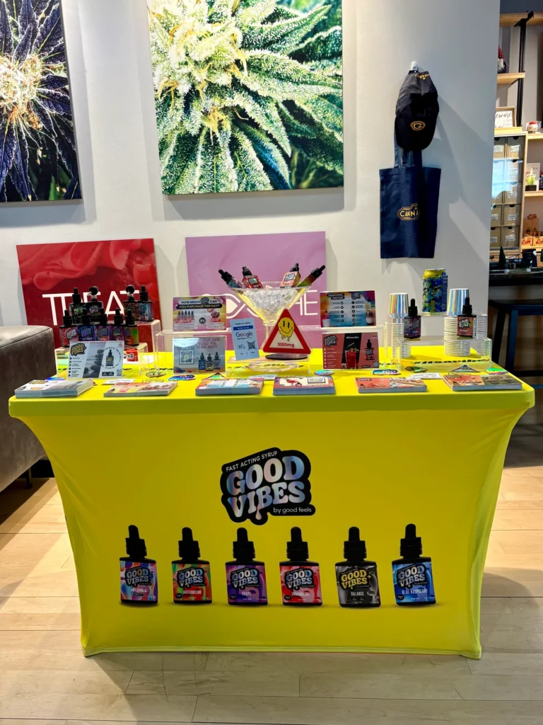 Good Vibes bottles and colorful display cards at Patriot Care - Greenfield.