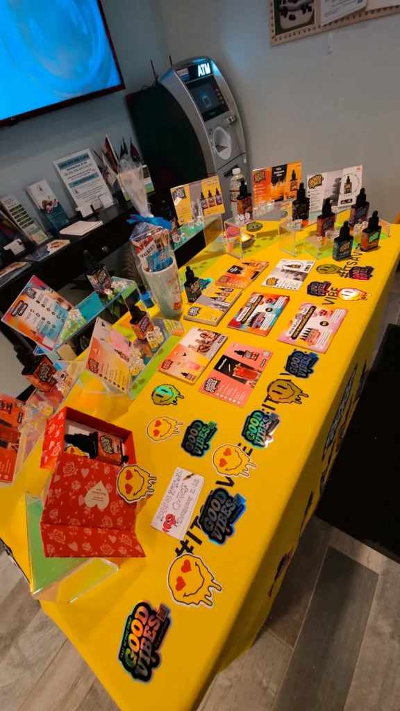 Good Vibes bottles and colorful display cards at Alternative Compassion Services - Bridgewater.