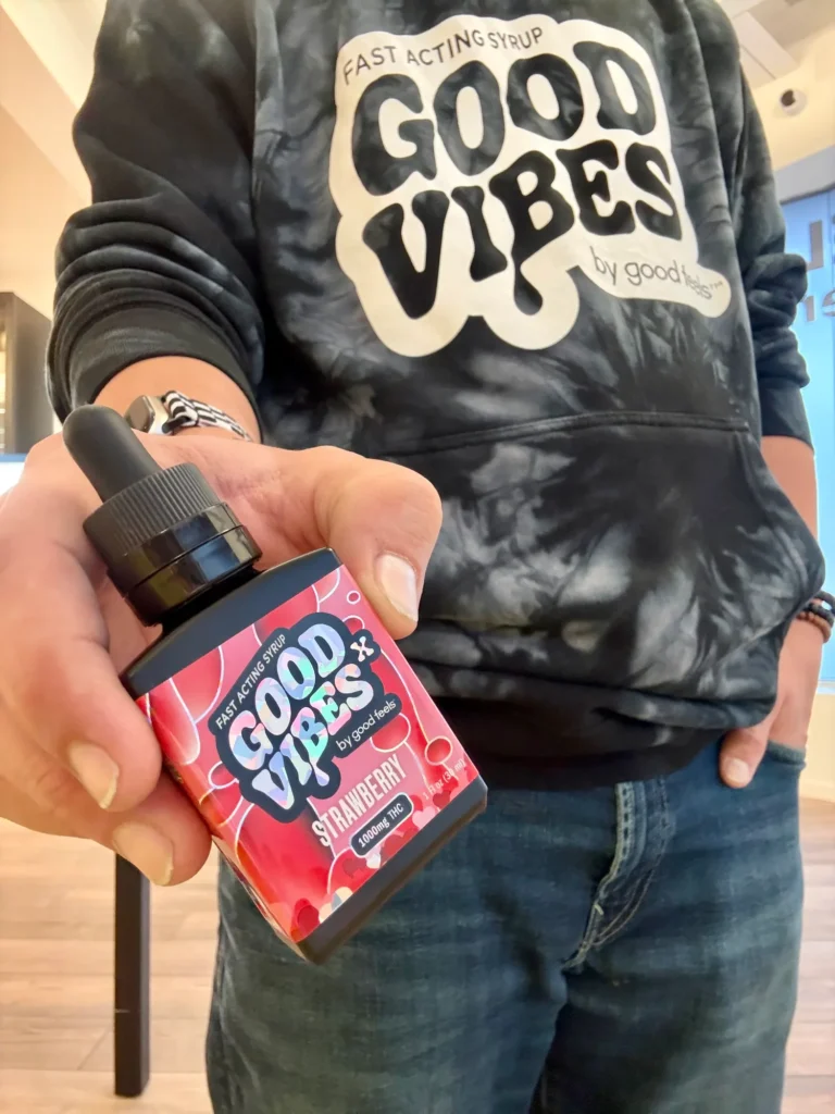 Good Vibes bottles and colorful display cards at Ascend - Newton.