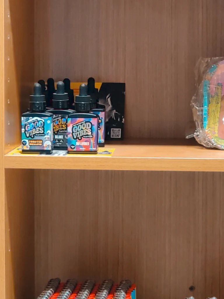 Bottles and colorful display cards at Aura - Fall River.