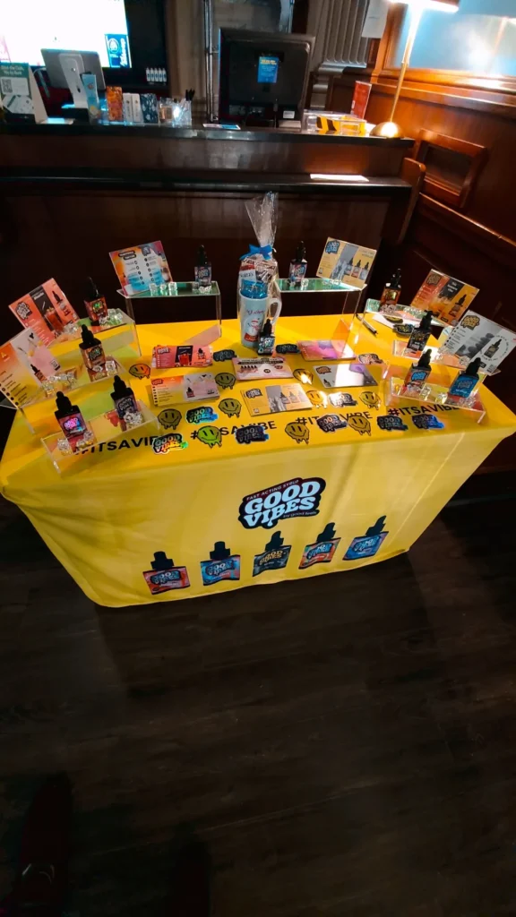 Bottles and colorful display cards at NETA - Brookline.