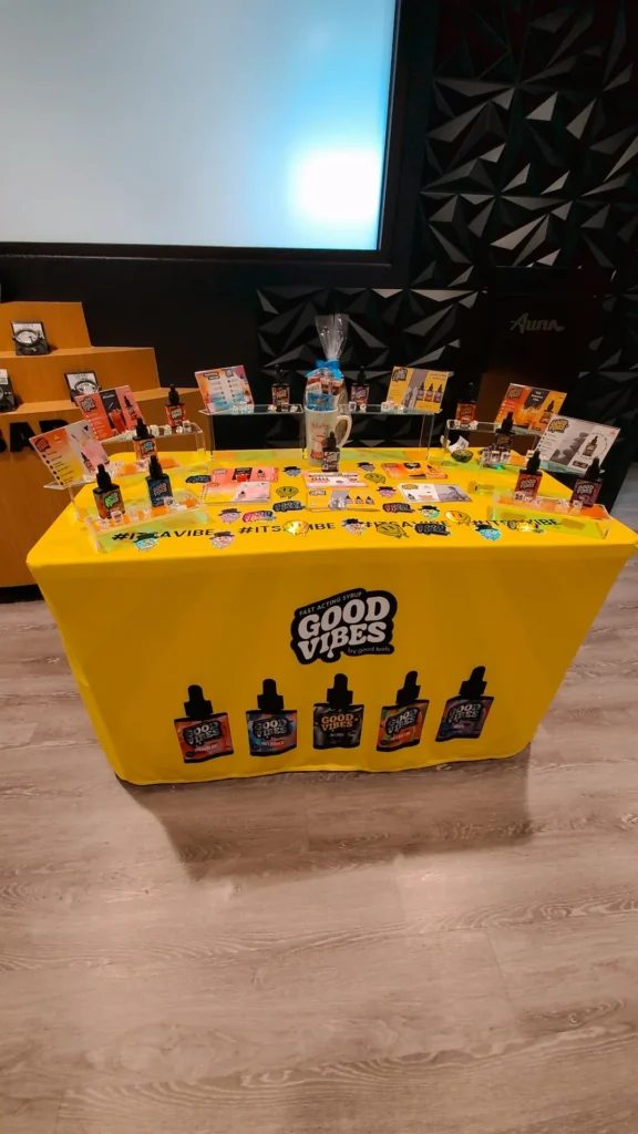 A Good Vibes sign anchoring the retail display at Aura - Fall River.