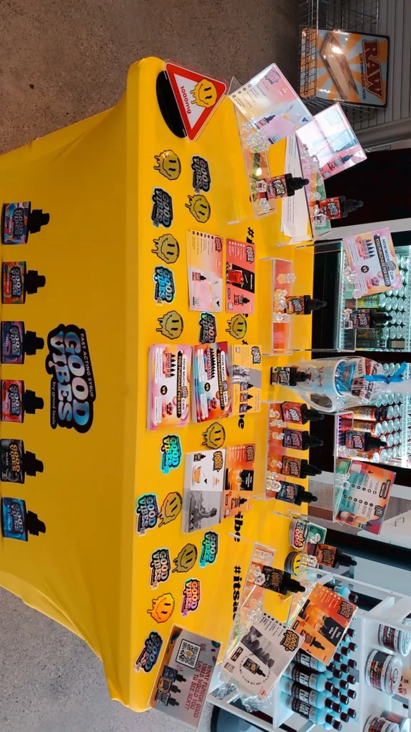 Good Vibes bottles and colorful display cards at Garden Remedies - Melrose.