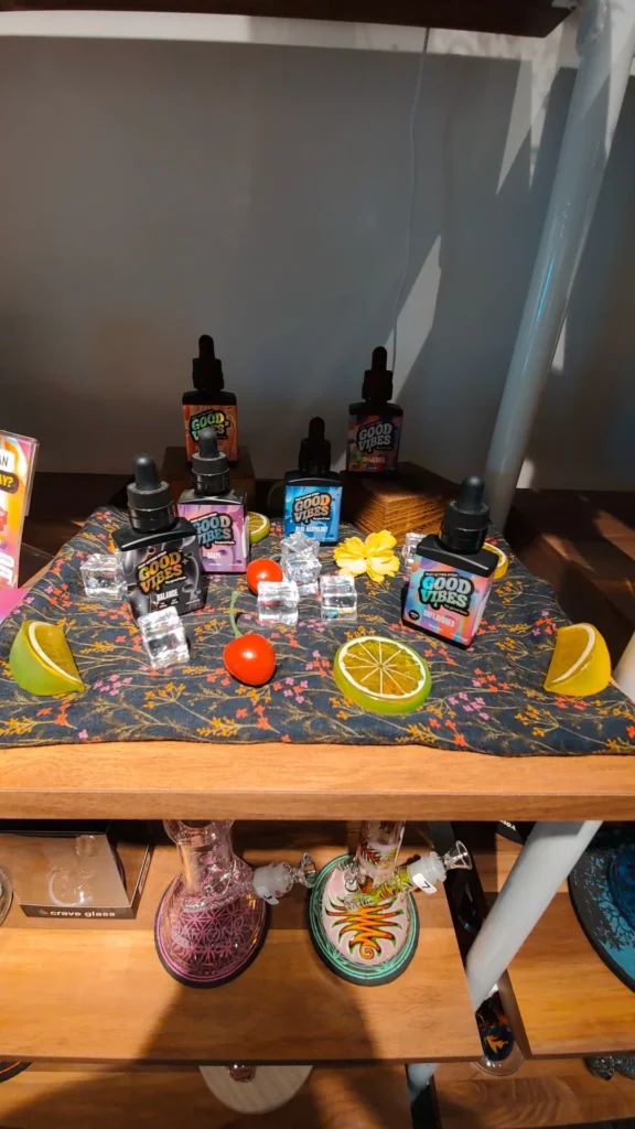 Bottles and colorful display cards at Cannabis of Worcester.
