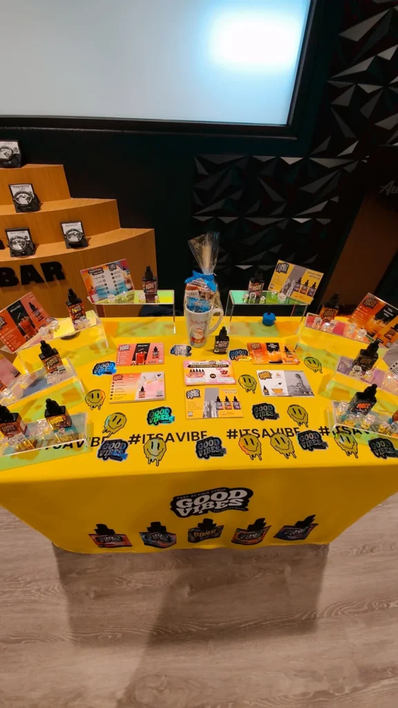 Bottles and colorful display cards at Aura - Fall River.