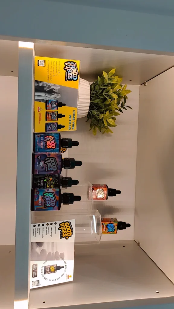 A Good Vibes sign anchoring the retail display at Redi - Natick.