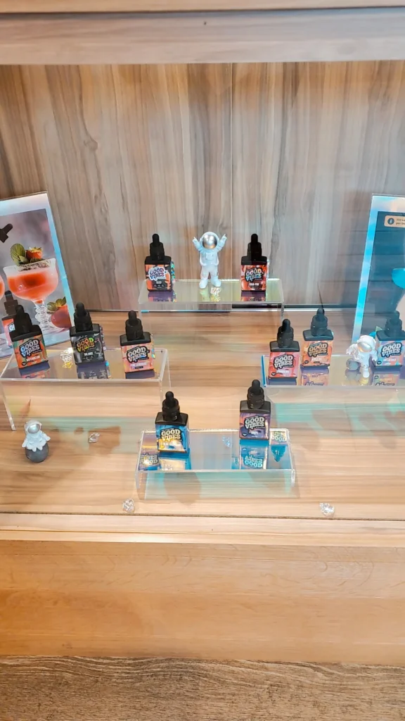 Bottles and colorful display cards at Renew Cannabis Co (Berkley).