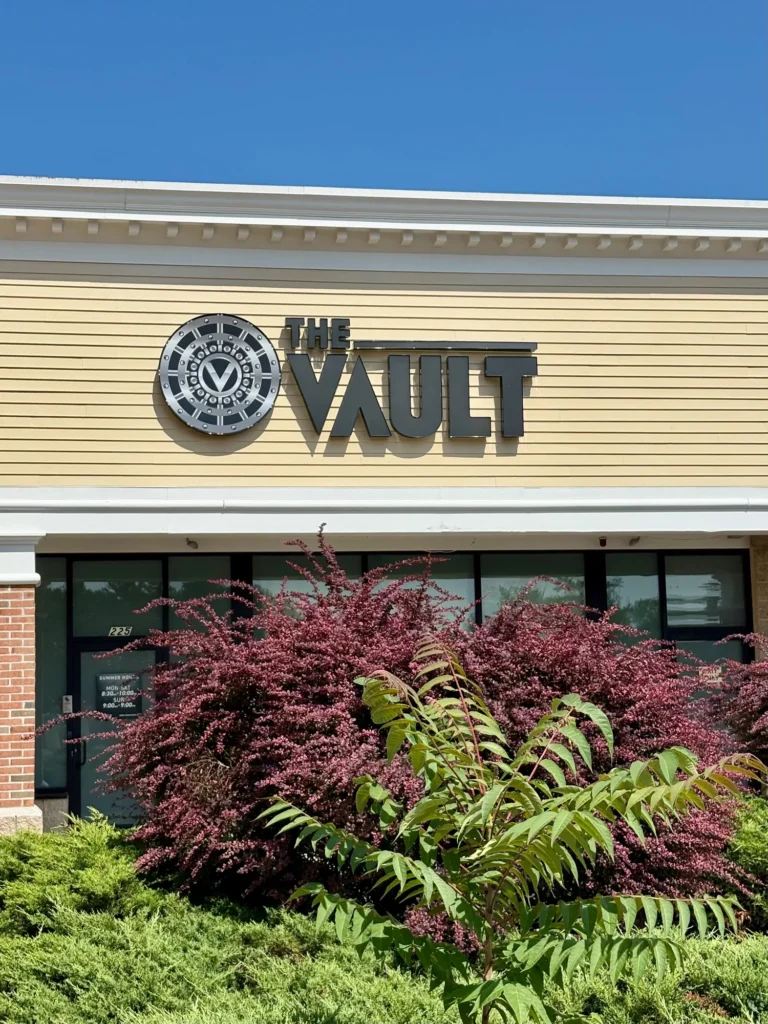 The Vault – Webster storefront and entry signage.