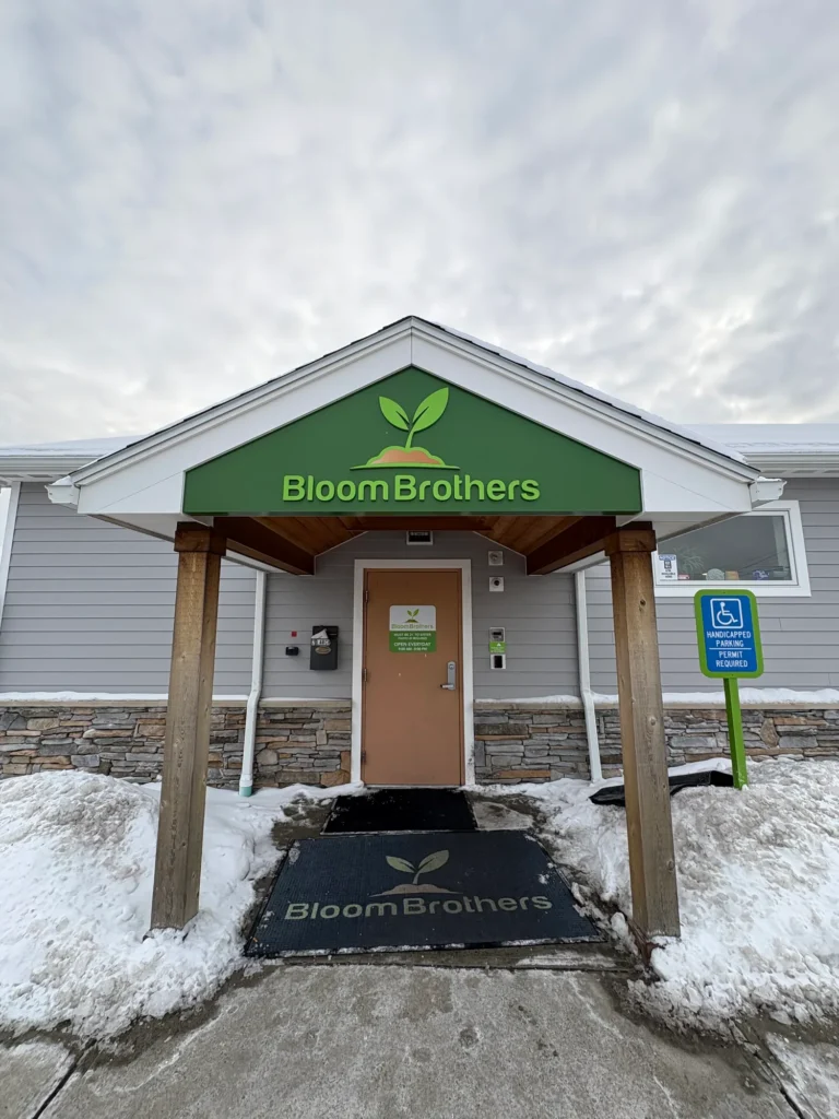 A warm-toned retail display with wood surfaces at Bloom Brothers - Pittsfield.