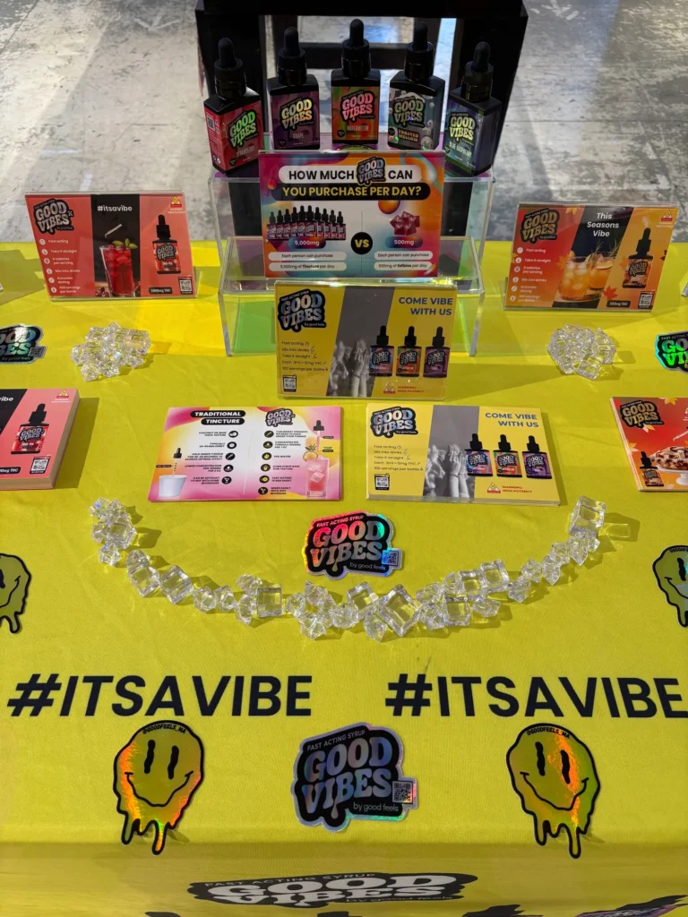 Good Vibes bottles and colorful display cards at Canna Provisions - Holyoke.