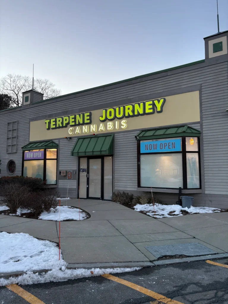 A warm-toned retail display with wood surfaces at Terpene Journey.