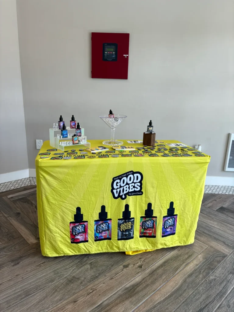 Warm retail display featuring fast-acting syrup and Balance at The Green Lady Dispensary – Newton.