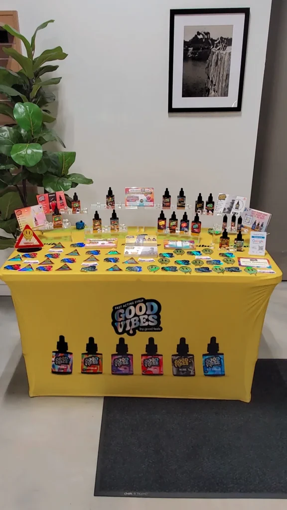 Good Vibes bottles and colorful display cards at Thrive Dispensary - Quincy.