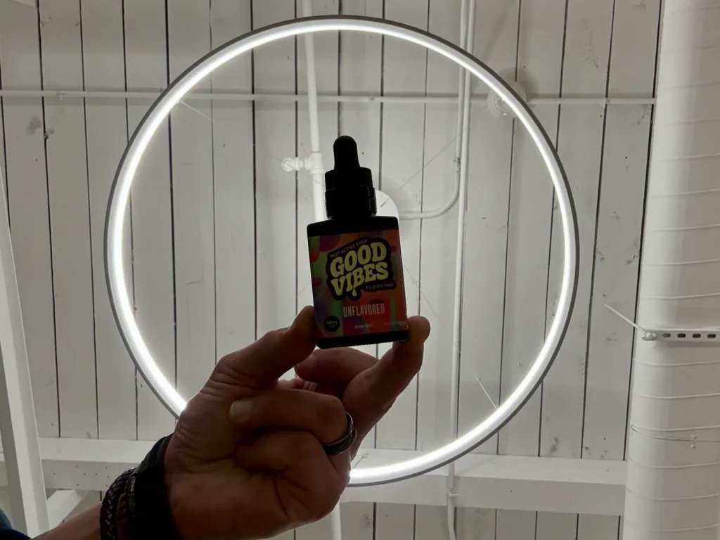Good Vibes bottles and colorful display cards at Ascend - Newton.