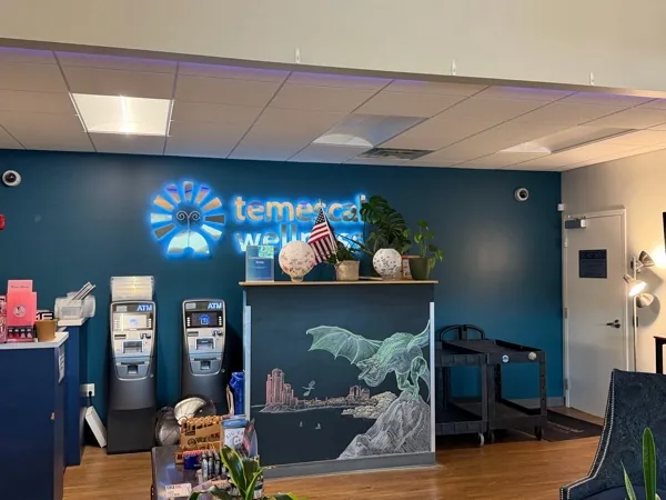 Blue Temescal Wellness sign above the reception area in Hudson.
