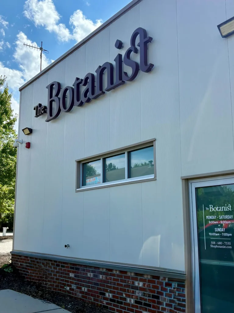 A retail sign anchoring the display at The Botanist - Worcester.