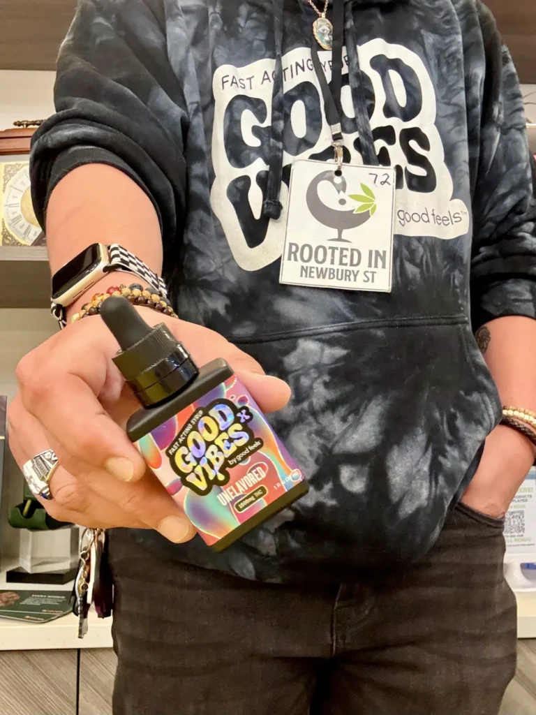 Good Vibes bottles and colorful display cards at Rooted In - Boston.