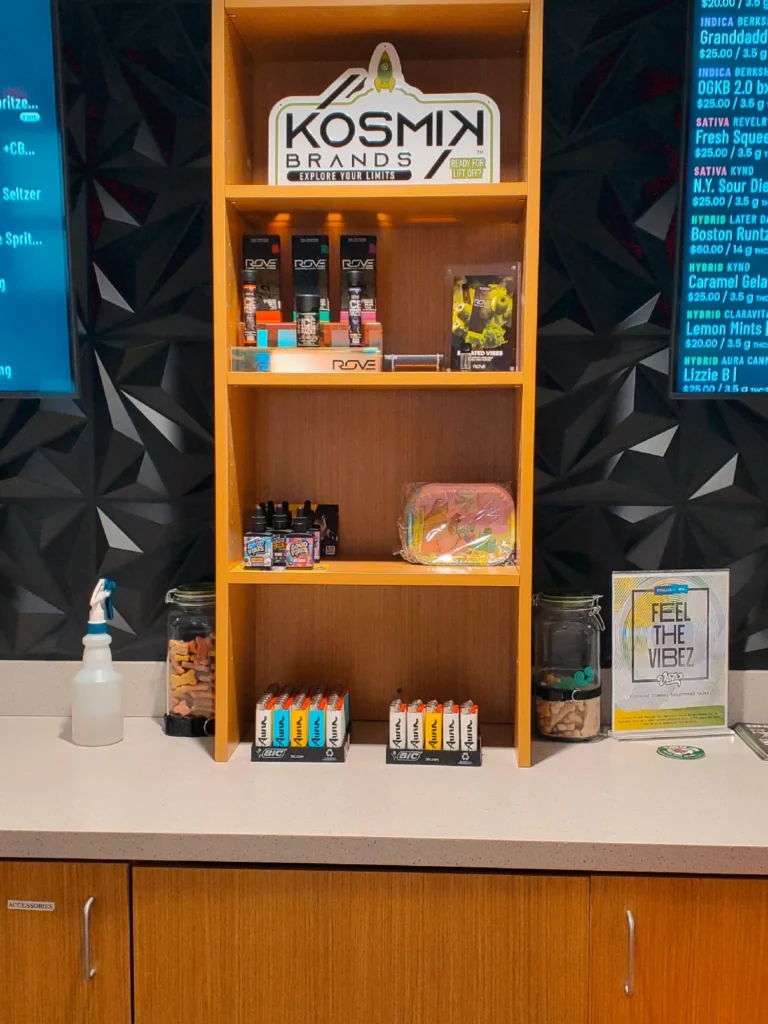 Bottles and colorful display cards at Aura - Fall River.