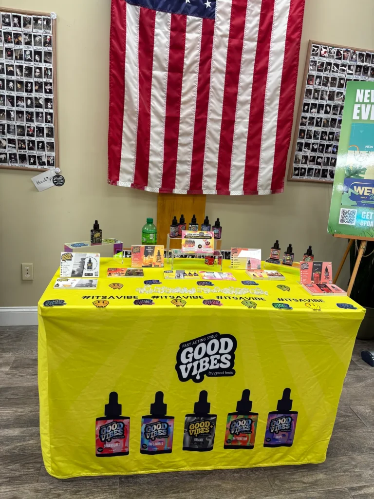 A Good Vibes sign anchoring the retail display at CNA Stores - Amesbury.