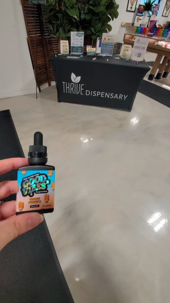 A retail sign anchoring the display at Thrive Dispensary - Quincy.