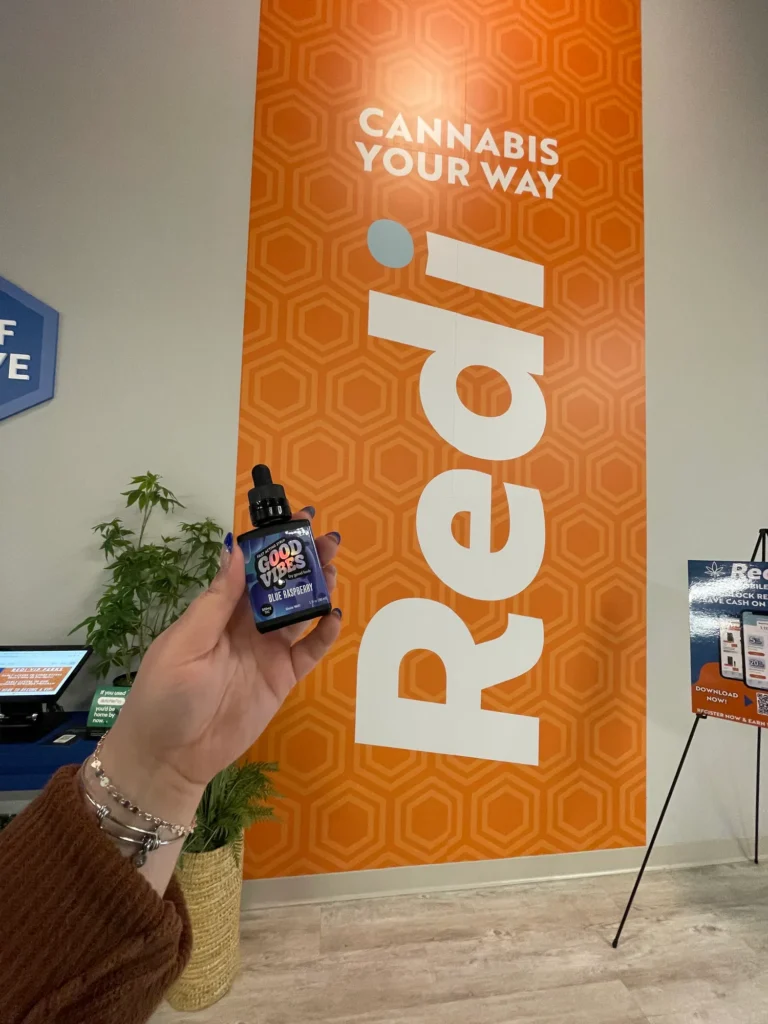 Bright branded display featuring products and signage at Redi – Natick.