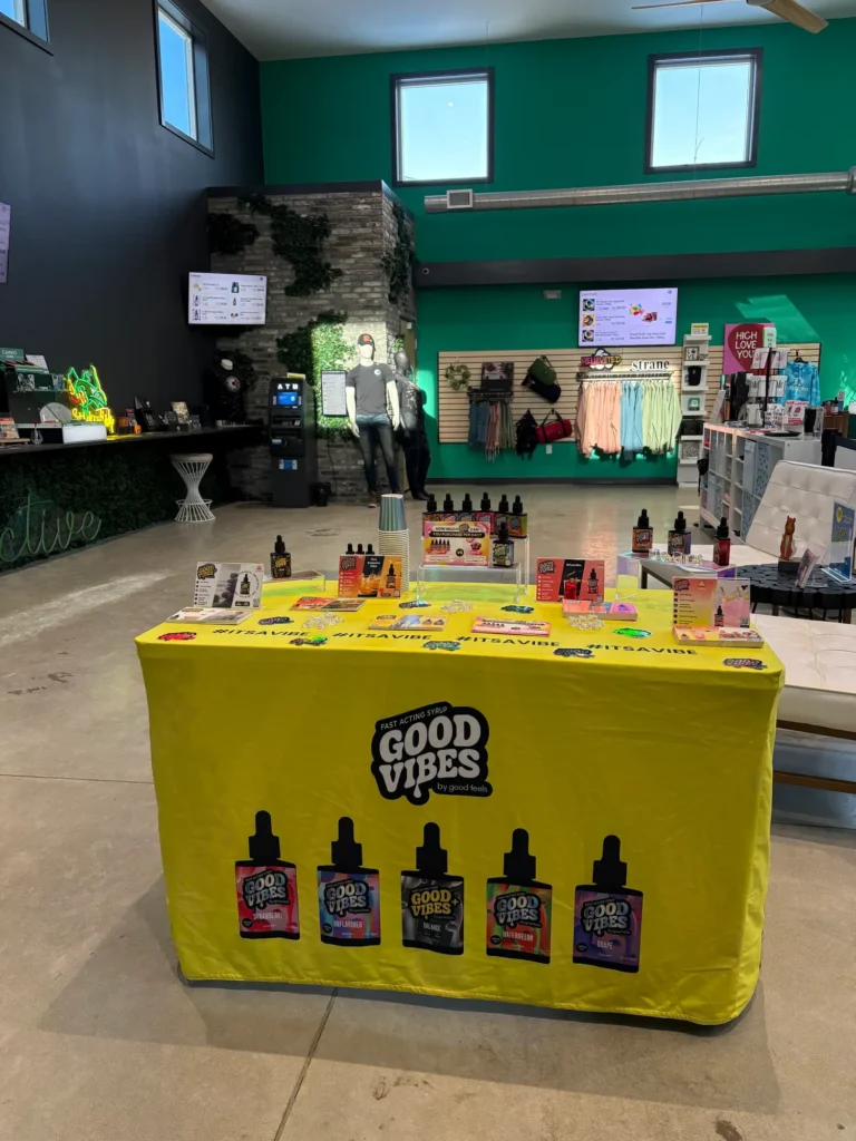A Good Vibes sign anchoring the retail display at Collective Premium Cannabis - Billerica.