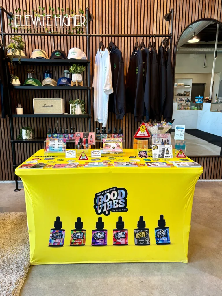 Good Vibes display with Blue Raspberry and Watermelon bottles at Pinnacle Cannabis – Quincy.