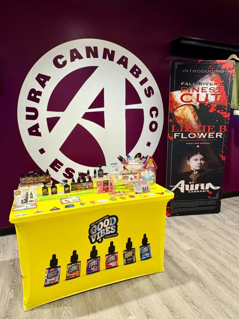 Good Vibes display with Good Vibes packaging and product information at Aura – Fall River.