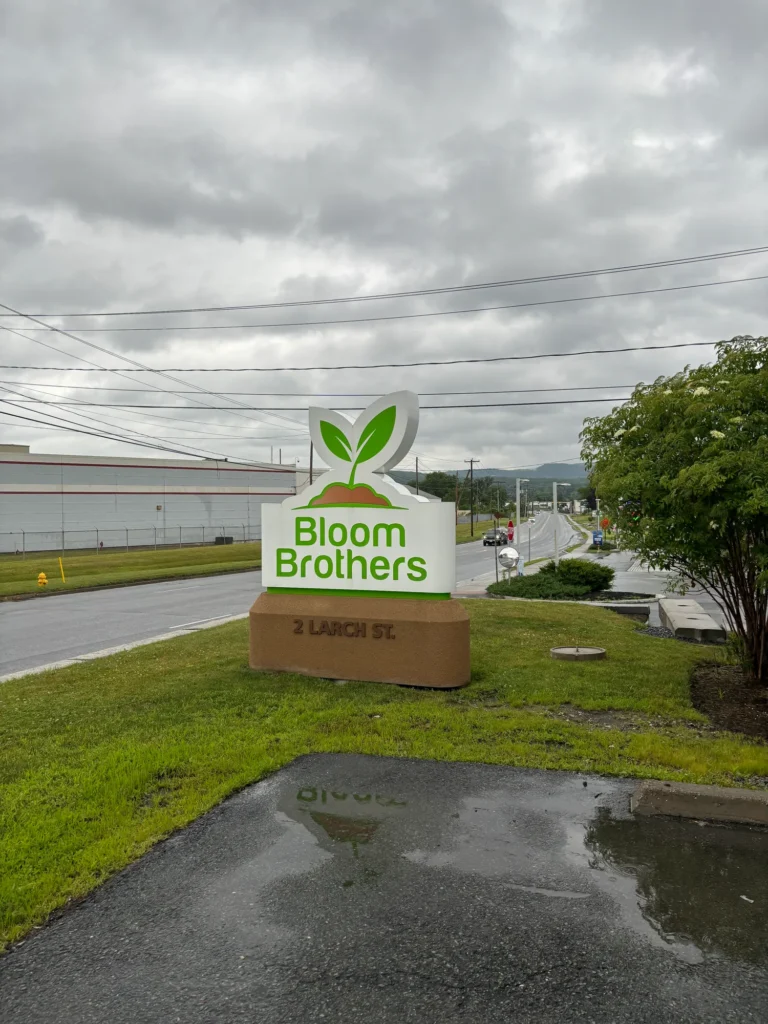 Playful storefront scene featuring products and signage at Bloom Brothers – Pittsfield.