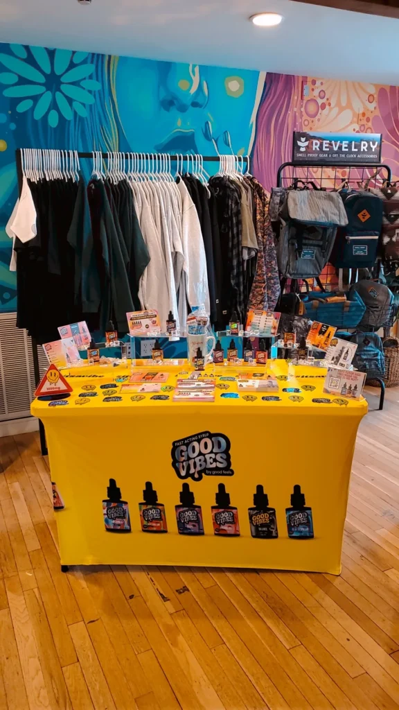 A Good Vibes sign anchoring the retail display at Garden Remedies - Newton.
