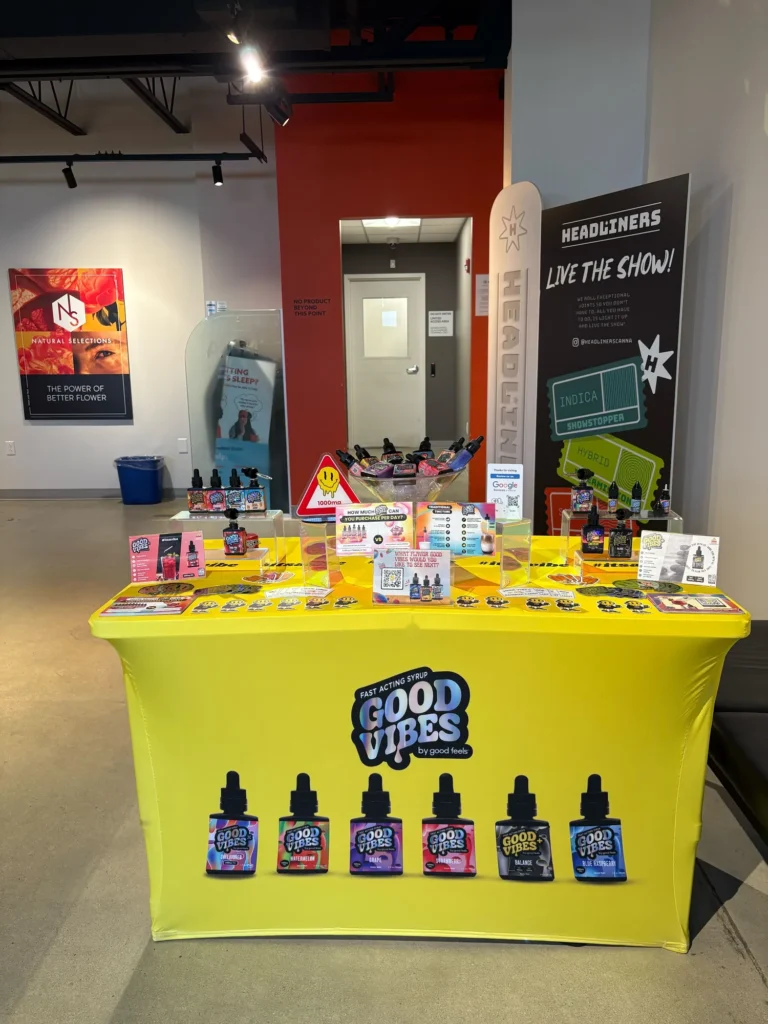 Good Vibes display with Blue Raspberry and Watermelon bottles at Ethos Cannabis – Fitchburg.