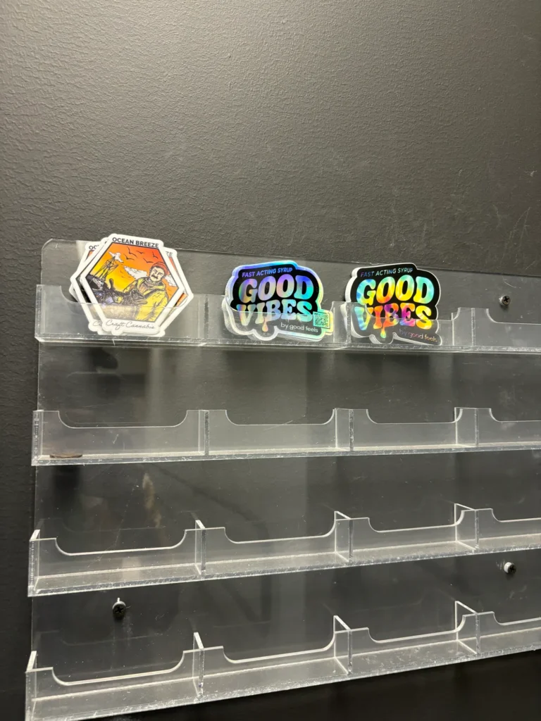 Colorful retail display featuring fast-acting syrup at Collective Premium Cannabis – Littleton.